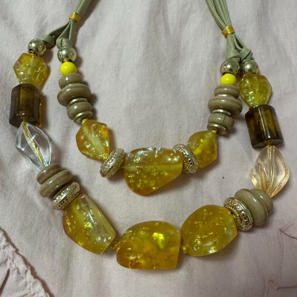 Yellow and tan beaded necklace with matching earrings.